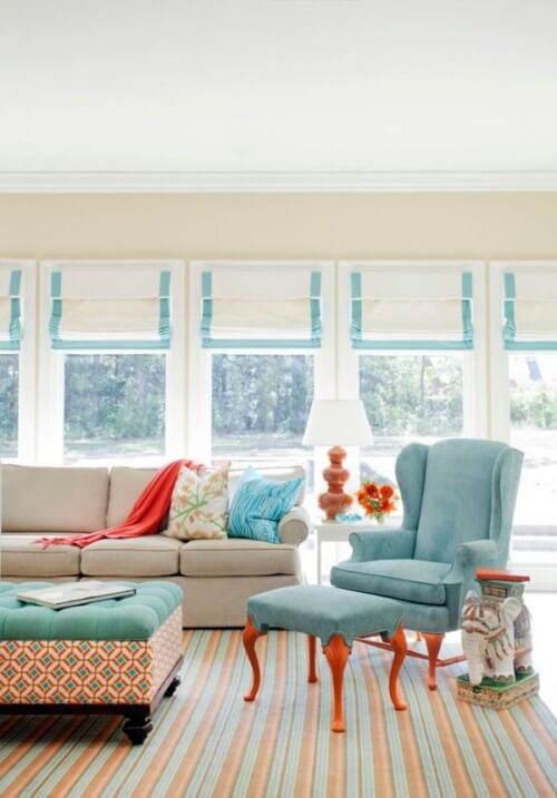 turquoise orange white living room decorating by tobi fairley 500x717 - Combinaciones de colores "diferentes" para un estilo fresco y renovado